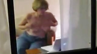 Voyeuring my mom toying in the living room Thumbnail